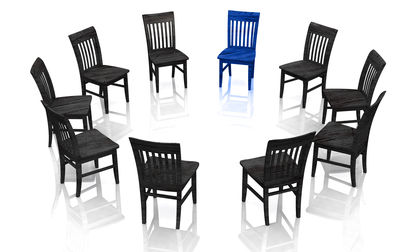 black chairs and one blue chair in circle
